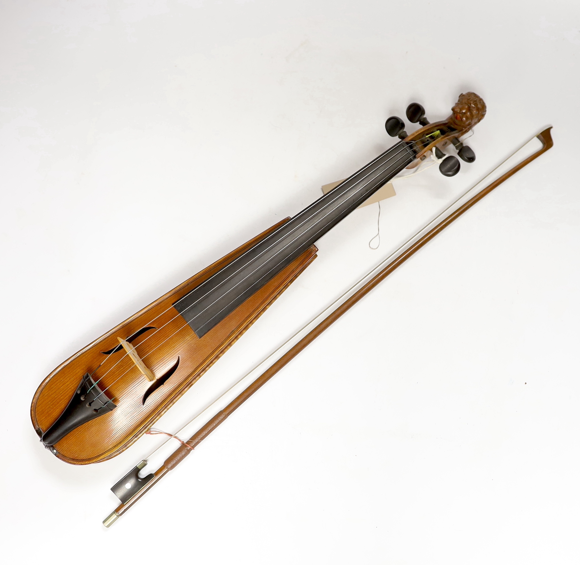 A 'travelling' violin and bow, the violin with grotesque head scroll carving, body 30.5cm